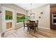 Cozy dining area with wood table and outdoor view at 3633 Gilpin Ct, Lawrenceville, GA 30044