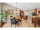 Dining area with wood table, plenty of light, and wood floors at 3633 Gilpin Ct, Lawrenceville, GA 30044