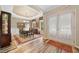 Bright dining room with tray ceiling, hardwood floors, and elegant furniture at 3633 Gilpin Ct, Lawrenceville, GA 30044