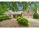 Charming brick home with a two-car garage, manicured landscaping, and inviting curb appeal at 3633 Gilpin Ct, Lawrenceville, GA 30044