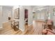 An open hallway featuring hardwood floors, elegant trim, and access to other rooms at 3633 Gilpin Ct, Lawrenceville, GA 30044