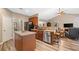 Kitchen featuring stainless appliances, center island, and wood floors at 3633 Gilpin Ct, Lawrenceville, GA 30044