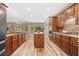 Modern kitchen with stainless steel appliances, island, and wood floors at 3633 Gilpin Ct, Lawrenceville, GA 30044