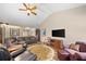 Spacious living room with vaulted ceilings, wood floors, and plenty of seating at 3633 Gilpin Ct, Lawrenceville, GA 30044