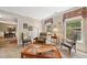 Bright living room showcasing comfortable seating, large windows, and classic decor at 3633 Gilpin Ct, Lawrenceville, GA 30044