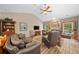 Open living room with fireplace, wood floors, and comfortable seating at 3633 Gilpin Ct, Lawrenceville, GA 30044