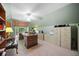Spacious office area with vaulted ceilings, lots of storage, a ceiling fan and a large desk at 3633 Gilpin Ct, Lawrenceville, GA 30044