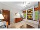 Bright office with built-in shelving, window seat, and plenty of storage space for a functional work environment at 3633 Gilpin Ct, Lawrenceville, GA 30044
