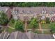 Aerial view of townhomes with lush landscaping and paved walkways at 7850 Willoughby Ct, Alpharetta, GA 30005