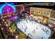 Festive ice skating rink surrounded by shops and holiday lights, ideal for winter fun at 7850 Willoughby Ct, Alpharetta, GA 30005