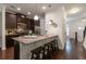 Modern kitchen features stainless steel appliances, granite countertops, and dark wood cabinets at 7850 Willoughby Ct, Alpharetta, GA 30005