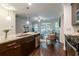 Open kitchen with stainless steel appliances, granite countertops and view to living area at 7850 Willoughby Ct, Alpharetta, GA 30005