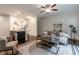 Open-concept living space with hardwood floors, modern decor, and a view into the kitchen area at 7850 Willoughby Ct, Alpharetta, GA 30005