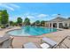Community pool with plenty of lounge chairs for residents to enjoy at 7850 Willoughby Ct, Alpharetta, GA 30005