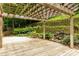 Wooden deck with a pergola provides a shady space to enjoy the landscaped backyard at 815 Marshview Close, Roswell, GA 30076