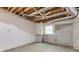 Unfinished basement with exposed ceiling, offering potential to customize and create additional living space at 815 Marshview Close, Roswell, GA 30076