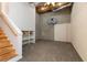Unfinished basement space with a basketball hoop and stairs, offering potential for customization at 815 Marshview Close, Roswell, GA 30076