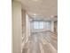Finished basement with plank floors, built-in shelving, and natural light from the windows at 815 Marshview Close, Roswell, GA 30076