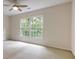 Bedroom with neutral walls, carpet flooring, and a large window for lots of natural light at 815 Marshview Close, Roswell, GA 30076