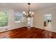 Dining room with hardwood floors, classic chandelier, and views of the kitchen through an open doorway at 815 Marshview Close, Roswell, GA 30076