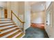 Spacious foyer featuring slate tile, hardwood stairs, and a view into an adjacent hardwood floor room at 815 Marshview Close, Roswell, GA 30076