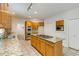 Modern kitchen with granite counters, a central island cooktop, wood cabinets and stainless appliances at 815 Marshview Close, Roswell, GA 30076