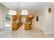 Bright kitchen featuring gas cooktop island, stainless appliances and spacious tile flooring at 815 Marshview Close, Roswell, GA 30076
