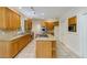 Bright kitchen featuring wooden cabinetry, granite counters, and a center island with cooktop at 815 Marshview Close, Roswell, GA 30076