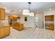 Spacious kitchen with tile flooring, granite counters, a central island and stainless steel appliances at 815 Marshview Close, Roswell, GA 30076