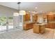 Gourmet kitchen features a gas cooktop island, stainless appliances and access to the backyard at 815 Marshview Close, Roswell, GA 30076