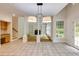 Open kitchen view showcasing tile flooring, work space and seamless connection to living area at 815 Marshview Close, Roswell, GA 30076