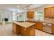 Open kitchen with granite countertops, center island cooktop, and stainless steel appliances at 815 Marshview Close, Roswell, GA 30076