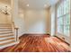 Bright, open living area with hardwood floors, a large window, and stairway access at 815 Marshview Close, Roswell, GA 30076