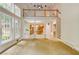 Bright and open living space showcasing large windows, pillars, an upstairs overlook, and an open view to the kitchen at 815 Marshview Close, Roswell, GA 30076