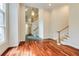 Bright living room boasts hardwood floors, staircase and large windows offering natural light at 815 Marshview Close, Roswell, GA 30076