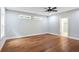 Bright bedroom with ensuite bathroom featuring hardwood floors, ceiling fan and plenty of natural light at 1653 Terry Mill Se Rd, Atlanta, GA 30316