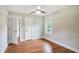 Cozy bedroom features hardwood floors, ceiling fan, and natural light from the window at 1653 Terry Mill Se Rd, Atlanta, GA 30316