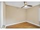 A minimalist bedroom with hardwood floors and a ceiling fan at 1653 Terry Mill Se Rd, Atlanta, GA 30316