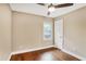 A sunlit bedroom showcases hardwood floors and a ceiling fan at 1653 Terry Mill Se Rd, Atlanta, GA 30316