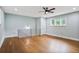 This bonus room has hardwood floors, railing, and natural light at 1653 Terry Mill Se Rd, Atlanta, GA 30316