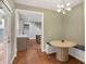 A cozy breakfast nook leading to the kitchen featuring built in bench seating and stylish light fixture at 1653 Terry Mill Se Rd, Atlanta, GA 30316