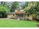 Charming two-story home featuring a lush lawn, covered porch, and attached garage at 1653 Terry Mill Se Rd, Atlanta, GA 30316