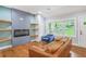 Cozy living room showcasing large windows, a fireplace, and contemporary decor at 1653 Terry Mill Se Rd, Atlanta, GA 30316