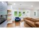 Bright living room featuring a fireplace, modern windows, and plenty of natural light at 1653 Terry Mill Se Rd, Atlanta, GA 30316