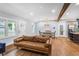 Stylish open-concept living space with hardwood floors, a modern kitchen, and a comfortable seating area at 1653 Terry Mill Se Rd, Atlanta, GA 30316