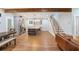 Spacious open-concept floorplan with hardwood floors and a modern kitchen with stainless steel appliances at 1653 Terry Mill Se Rd, Atlanta, GA 30316