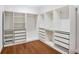 Large walk-in closet with custom shelving, drawers and hardwood floors offers plenty of storage space at 1653 Terry Mill Se Rd, Atlanta, GA 30316