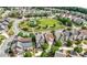 Aerial view of neighborhood with a green park and well-manicured lawns at 1741 Hickory Path Way, Suwanee, GA 30024