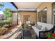 Inviting back porch with comfortable seating and views of the landscaped yard at 1741 Hickory Path Way, Suwanee, GA 30024