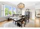 Bright dining room with large windows and stylish lighting fixture at 1741 Hickory Path Way, Suwanee, GA 30024